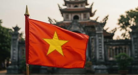 Red Flag with Yellow Star Waving near Ancient Brick Buildings