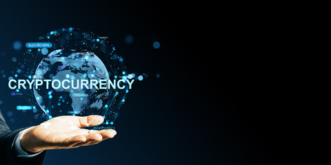 Businessman hand holding digital globe with cryptocurrency network and blockchain terms on dark background for finance and technology banner template.