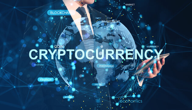 Businessman using tablet with cryptocurrency hologram and global blockchain data overlay on dark background, symbolizing digital finance network.
