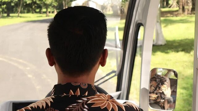 Professional Shuttle Driver Transporting Visitors in Borobudur Heritage Site