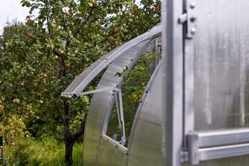 polycarbonate greenhouse in the garden. .