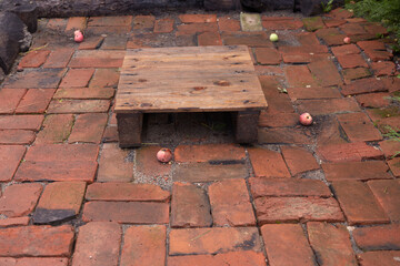 the playground is made of old red brick. recreation area.