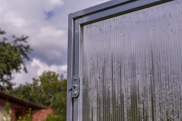 polycarbonate greenhouse in the garden. .