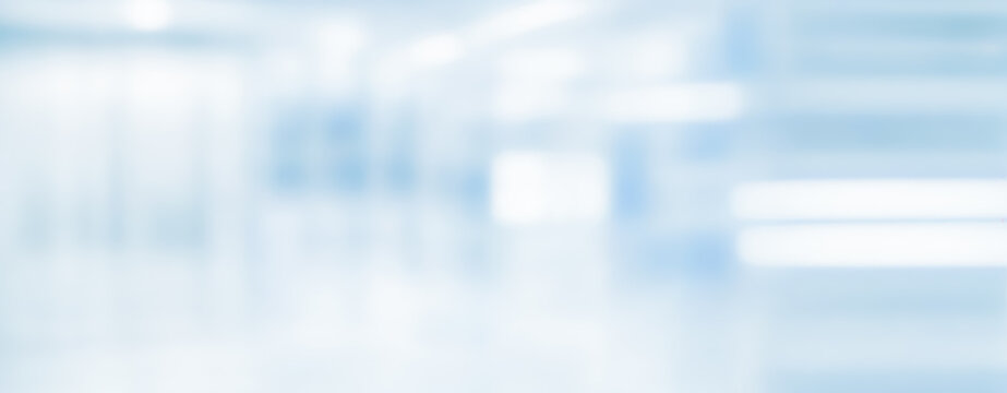 Blurred abstract background with soft blue and white tones creating a neutral backdrop.