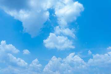 Vibrant Blue Sky with Fluffy White Cumulus Clouds Sunny Day Weather Background