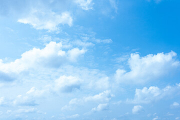 Serene Blue Sky with Fluffy White Clouds Natural Background Image