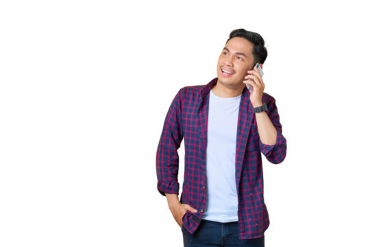 Smiling young Asian man in plaid shirt talking on mobile phone and looking away at copy space isolated on transparent background