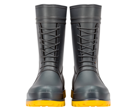 Pair of black work boots with yellow soles on a transparent background