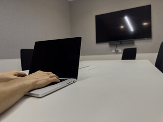 Business Meeting Setup with Laptop in Conference Room