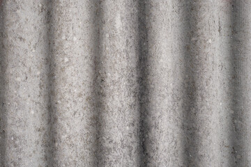 Old and very dangerous asbestos roof. Asbestos dust in the environment. Asbestos removal