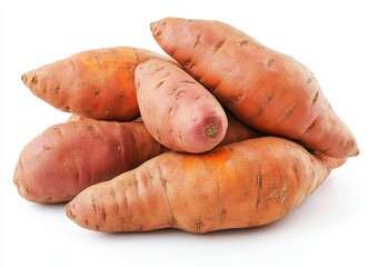 Fresh sweet potatoes piled together on a white background ready for cooking or baking in various recipes