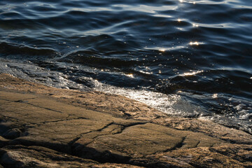 Small waves on rocky beach