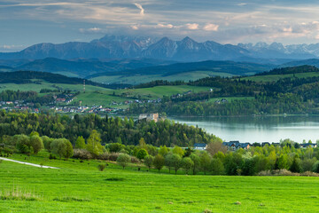 Scenic Landscape of Czorsztyn Lake and Tatras Behind Historic Castle..