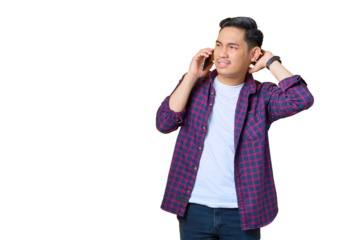 Confused young Asian man in plaid shirt talking on mobile phone and looking away at copy space isolated on transparent background