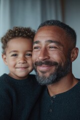 Obraz premium warmly lit scene with father and child interacting their smiles reflecting joy