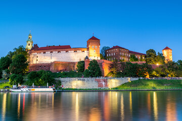 Evening View of Wawel Castle Reflected in Vistula Waters in Cracow , Poland