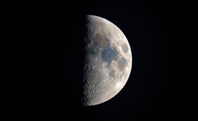Naklejka premium Close up picture of waxing crescent moon in blue sky