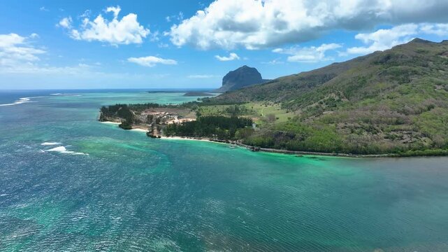 Aerial view of the emerald Indian Ocean meeting cliffs and coastal curves at the famous Maconde Viewpoint, Mauritius