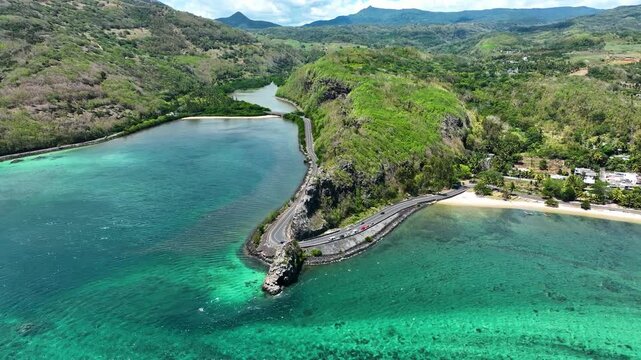 Aerial view of the emerald Indian Ocean meeting cliffs and coastal curves at the famous Maconde Viewpoint, Mauritius