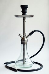 Sleek metal hookah, clear glass bowl, white backdrop , decor, interior, contemporary