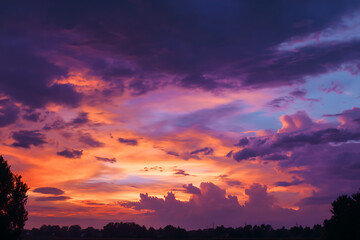 Fototapeta premium Vibrant Sky At Dusk Majestic Sunset With Colorful Clouds Above Rural Landscape Stunning Atmospheric Phenomena