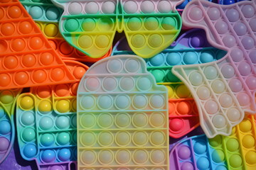 Interesting children's rubber and silicone toys antistress of different colors - pop it