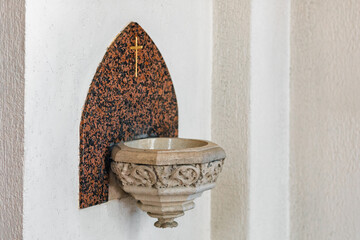 Holy Water Font on Church Wall with Ornamental Stone Base