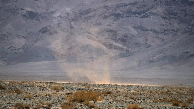A rotating vortex of a dust storm in the vast expanses of the Gobi Desert, Mongolia