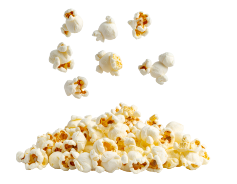falling popcorn kernels in motion with a pile below, crispy white snack food isolated on background
