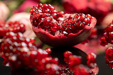 pomegranate seeds on the table, peeled red pomegranate