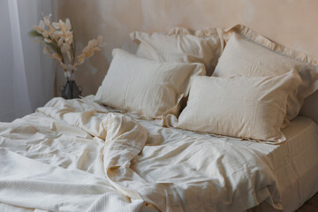 A beautifully made bed adorned with crisp white sheets and plush pillows inviting you into a cozy bedroom ambiance