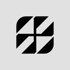 Abstract geometric emblem features a four-section symmetrical design with angular patterns in black and white.