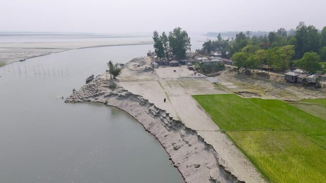Aerial shot of a Village beside a brunch of Brahmaputra River in Kurigram, Bangladesh
