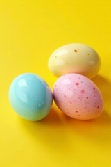 Vibrant pastel eggs, speckled & solid, on sunny yellow , springtime, decoration