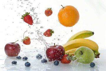 Fresh Mixed Fruits Splashing in Water on White Background