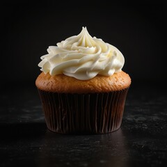 Delicious vanilla cupcake with white frosting isolated on black background dessert sweet treat