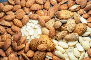 Large group of different almond nuts close-up. Food background.