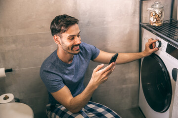 Man Using Washing Machine