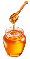 Honey dripping from honey spoon into honey pot on white background. File contains clipping path.