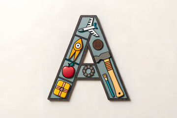Illustrated Letter 'A' with Airplane, Apple, Rocket, and Art Tools – Creative Alphabet Design