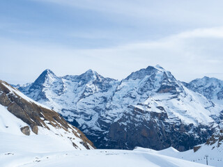 Muerren, Switzerland - February 18tht 2024: Beautiful view from the skiing resort towards high...