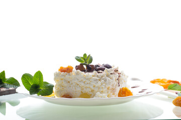 sweet cottage cheese breakfast in a plate with chocolate syrup with candied fruits
