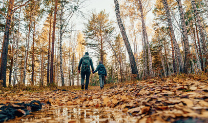 Fototapeta premium Family hiking trip with kids be a great way for a family to spend quality time together. It is an excellent way to appreciate nature and get fresh air.