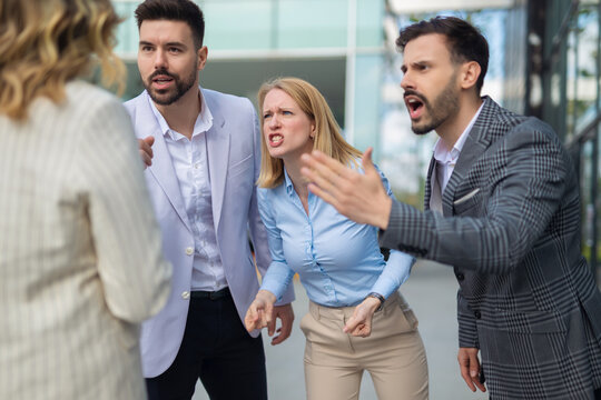 Colleagues arguing and shouting in a heated business conflict - Powered by Adobe