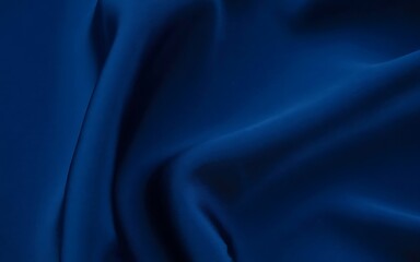 Elegant navy blue fabric with soft folds and subtle shadows creates a textured background