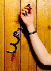 A woman hand in handcuffs