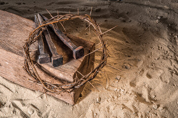 Crown of Thorns associated with the Passion of Jesus Christ. Fragment of a wooden cross symbol of the Crucifixion at Calvary and Good Friday in Christianity according to the New Testament