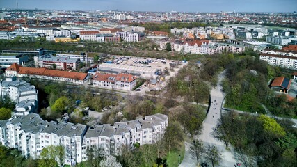 View of Munich from above, from Westpark. A sunny day after a rain, a bright horizon. Aerial shot, drone.