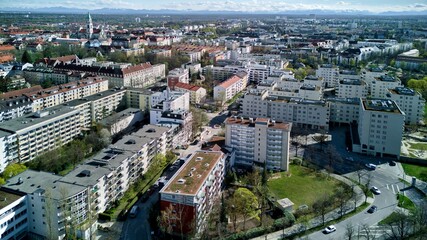 View of Munich from above, from Westpark. A sunny day after a rain, a bright horizon. Aerial shot, drone.