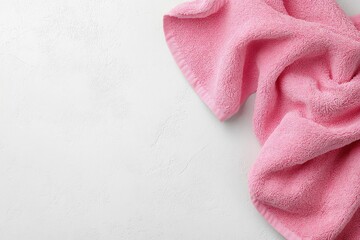 Pink Towel on White Textured Surface